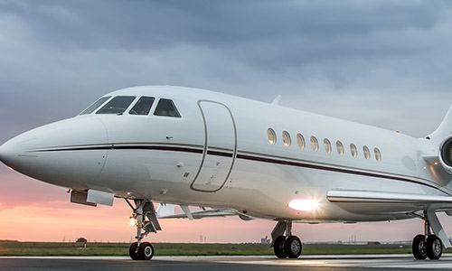 Airplane on runway during sunrise