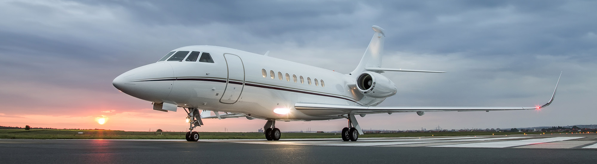 Airplane on runway during sunrise