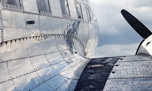 Side of a metal riveted airplane